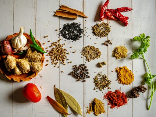 a variety of spices on a white table